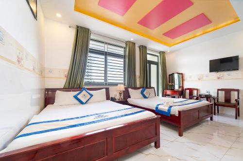 Giường trong phòng chung tại Bảo Đăng 2 Hotel