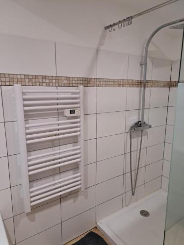 a bathroom with a shower with a glass door at Maison au calme in Saramon
