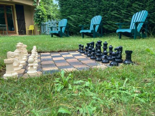 a chess game on a brick path in the grass at Casa Bauxells in Sahorre