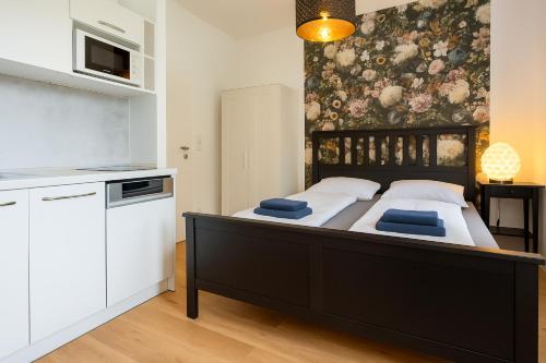 Cama o camas de una habitación en DAINN Apartments Schönbrunn