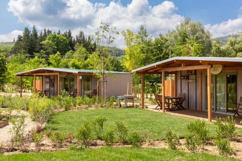 a home with a garden and a patio at Palagina Il Borgo Agricolo in Figline Valdarno