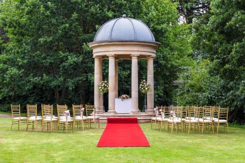 a gazebo with chairs and a red carpet at Royal Court Hotel & Spa Coventry in Coventry