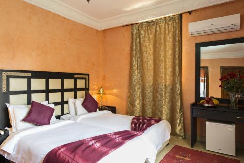 Postel nebo postele na pokoji v ubytování Marrakech House