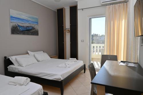 Ένα ή περισσότερα κρεβάτια σε δωμάτιο στο EROS HOTEL Ksamil