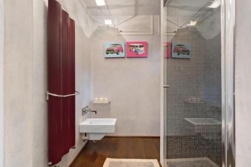 a bathroom with a shower and a toilet and a sink at Tenuta Virgilio Colline del Chianti in Tavarnelle in Val di Pesa