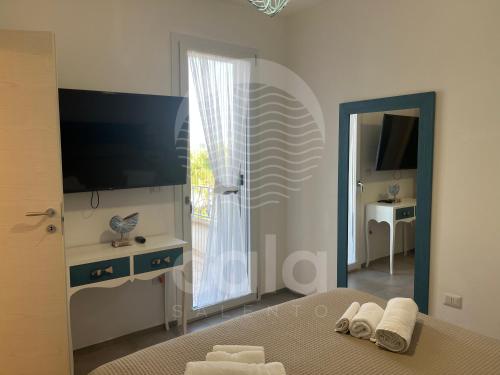 Et tv og/eller underholdning på Villetta Kalamia - Piscina privata By Cala Salento