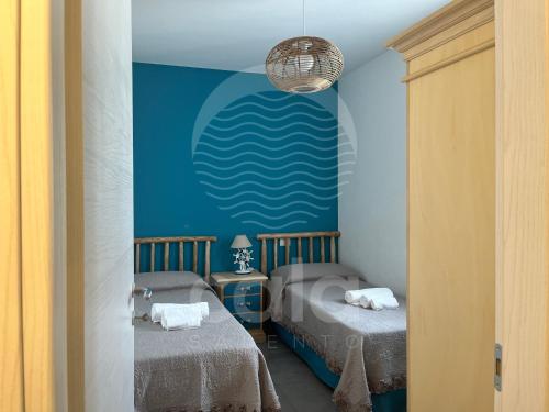 En eller flere senge i et værelse på Villetta Kalamia - Piscina privata By Cala Salento