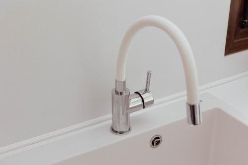 a kitchen sink with a faucet on a counter at Vista Alykes in Ammouliani
