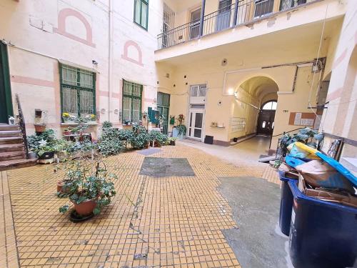 an empty courtyard with potted plants in a building at B42 Cozy in Budapest