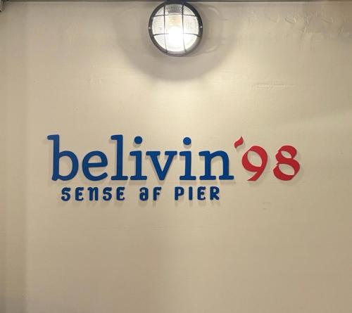 a sign on the wall of a room with the beulyn sense at Belivin'98 Sense of Pier Sathorn Residence in Bangkok