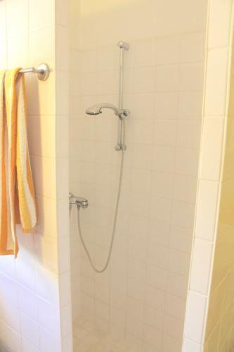a shower with a hose in a bathroom at villa jardin al mar in Playa Jandia