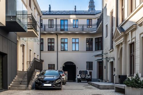 a car parked in front of a building at MYE Apartments - Piotrkowska 44 in Łódź