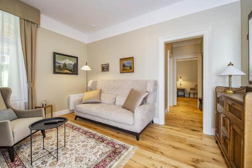 a living room with a couch and a table at Vila Lavina in Smokovce