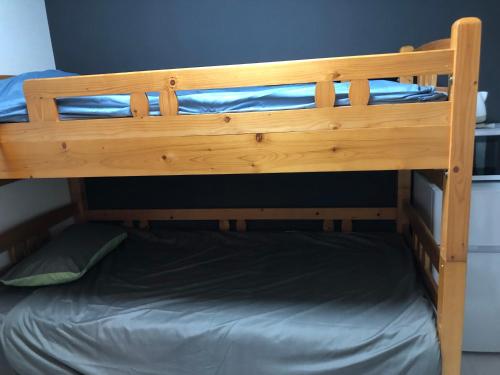 a wooden bunk bed in a room at 桜屋Sakuraya201 in Tokyo