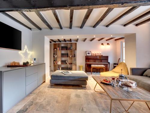 a living room with a couch and a table at The Nook by Luxury Travel Emporium Asygarth in Aysgarth