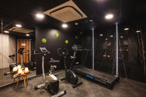 a gym with several exercise bikes and a treadmill at Focus Hotel Premium Gdańsk in Gdańsk