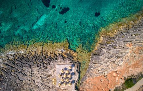 an aerial view of a cave in the ocean at Universal Hotel Romantica in Colonia Sant Jordi