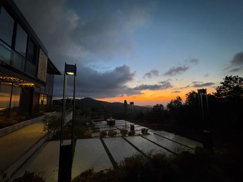 a view of a sunset from the outside of a building at AlFahed Farm in Ajloun