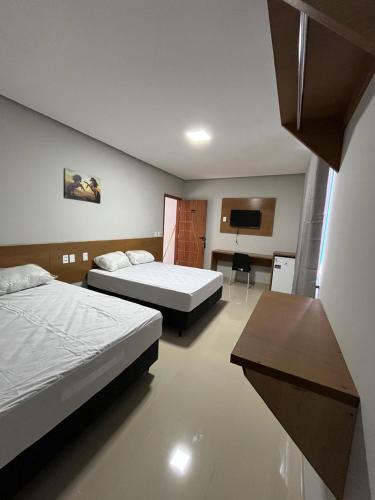 Ένα ή περισσότερα κρεβάτια σε δωμάτιο στο Hotel São Lázaro