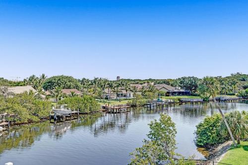 an aerial view of a river with houses and docks at Unique Retreat - Unit A: Cozy First-Floor Oasis in Deerfield Beach