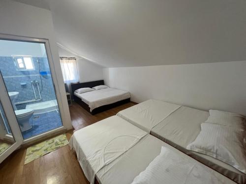 Postel nebo postele na pokoji v ubytování Casa Flaviu Eforie Sud