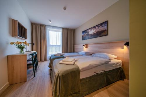 Postel nebo postele na pokoji v ubytování Osada Zborów Camp & Bed