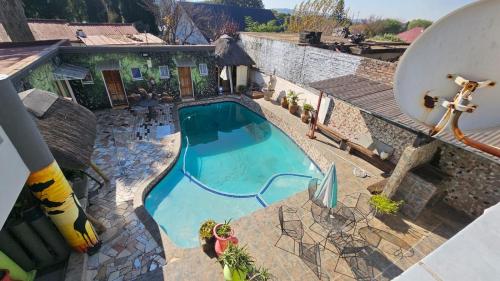 an overhead view of a swimming pool in a house at Lydia's in Johannesburg
