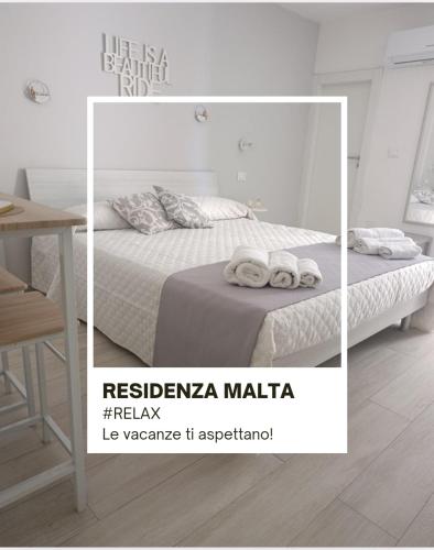 Ένα ή περισσότερα κρεβάτια σε δωμάτιο στο Residenza Malta
