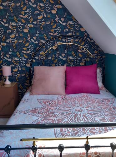 Una cama o camas en una habitación de Gîte De L'alliance