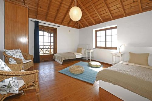 En eller flere senge i et værelse på Casa El Buen Jesús