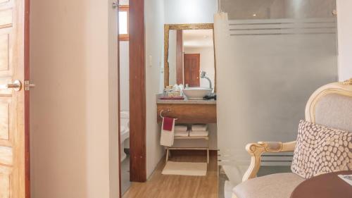 a bathroom with a sink and a mirror at Boutique Hotel in Quito Hotel Casona 1914 in Quito