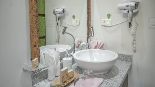 a bathroom with a sink and a mirror at Boutique Hotel in Quito Hotel Casona 1914 in Quito