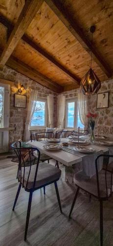 a dining room with a large table and chairs at Castio del Monte Winery & Resort in Petrovac na Moru