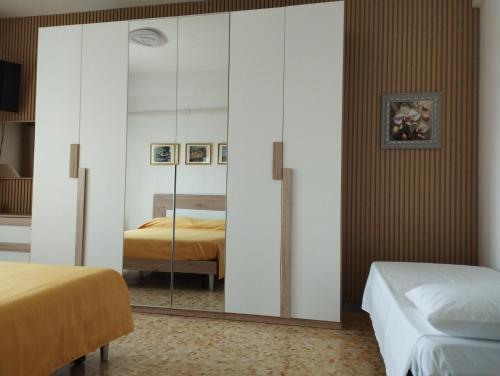 Ένα ή περισσότερα κρεβάτια σε δωμάτιο στο Il Melograno - Just like at home!