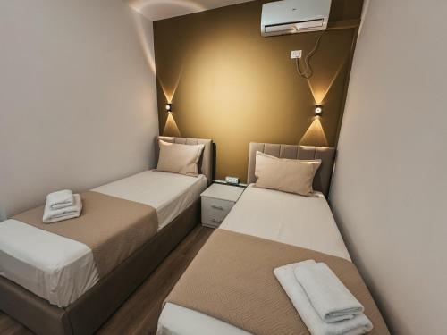 Postel nebo postele na pokoji v ubytování Relaxx Apartment & Hotel