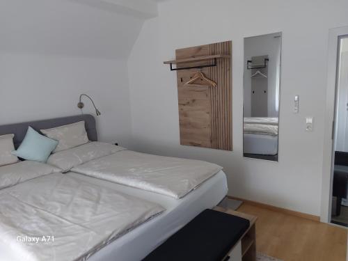 a small bedroom with a bed and a closet at Ferienhaus Käthe in Klagenfurt