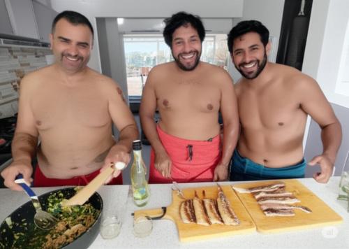 three shirtless men standing in front of a table with food at Pelados Beach Hostel in Pipa