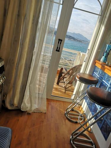 a room with a view of the ocean at Paradise found in Rafina
