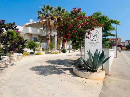 a sign with a no smoking sign on a street at Apartments and Rooms Mateša in Vodice