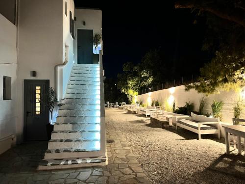 a staircase leading up to a building at night at aeolian blu 5 in Parikia