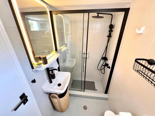 a bathroom with a sink and a shower at aeolian blu 10 in Parikia