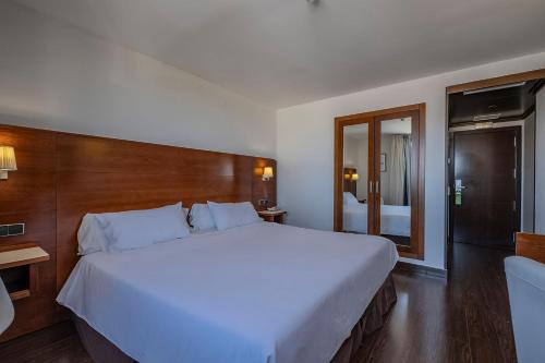 Postel nebo postele na pokoji v ubytování Hotel Hidalgo