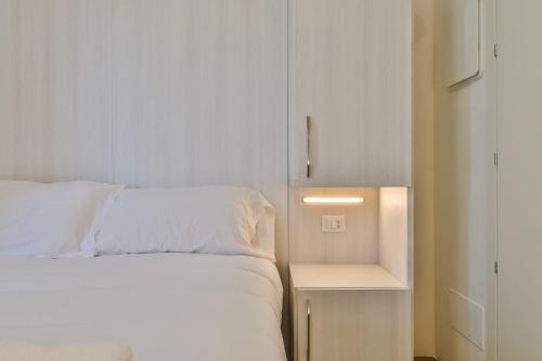 Ένα ή περισσότερα κρεβάτια σε δωμάτιο στο Mazzini Rooms
