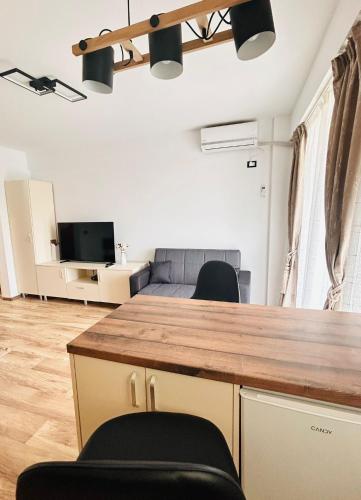 a kitchen and living room with a counter and chairs at Asi Marine Rentals in Saturn
