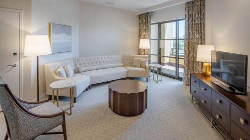 a living room with a couch and a television at YO1 Longevity & Health Resorts, Catskills in Monticello