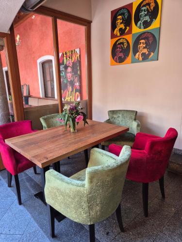 a dining room with a wooden table and chairs at Lindengut Natternbach in Natternbach