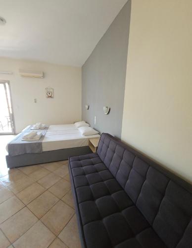 Postel nebo postele na pokoji v ubytování Joanna Apartments