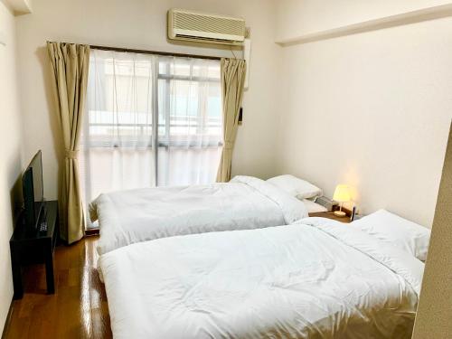 Vuode tai vuoteita majoituspaikassa 鹿鸣新荣