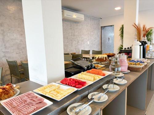 a buffet line with many different types of food at Sunset by AFT - PORTO DE GALINHAS in Porto De Galinhas