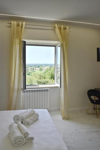 Letto o letti in una camera di Relais Serenitas